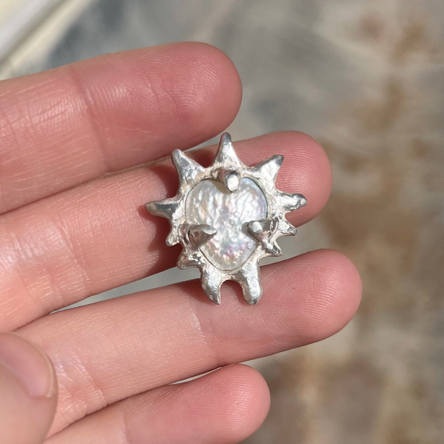 NORAPE silver pendant