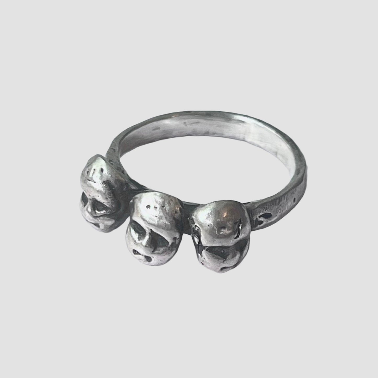 Silver ring with baby heads