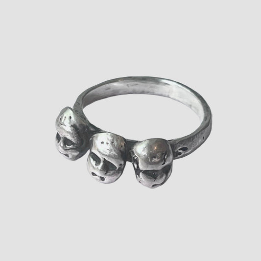 Silver ring with baby heads